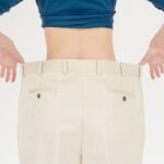 crop slender woman in oversized pants